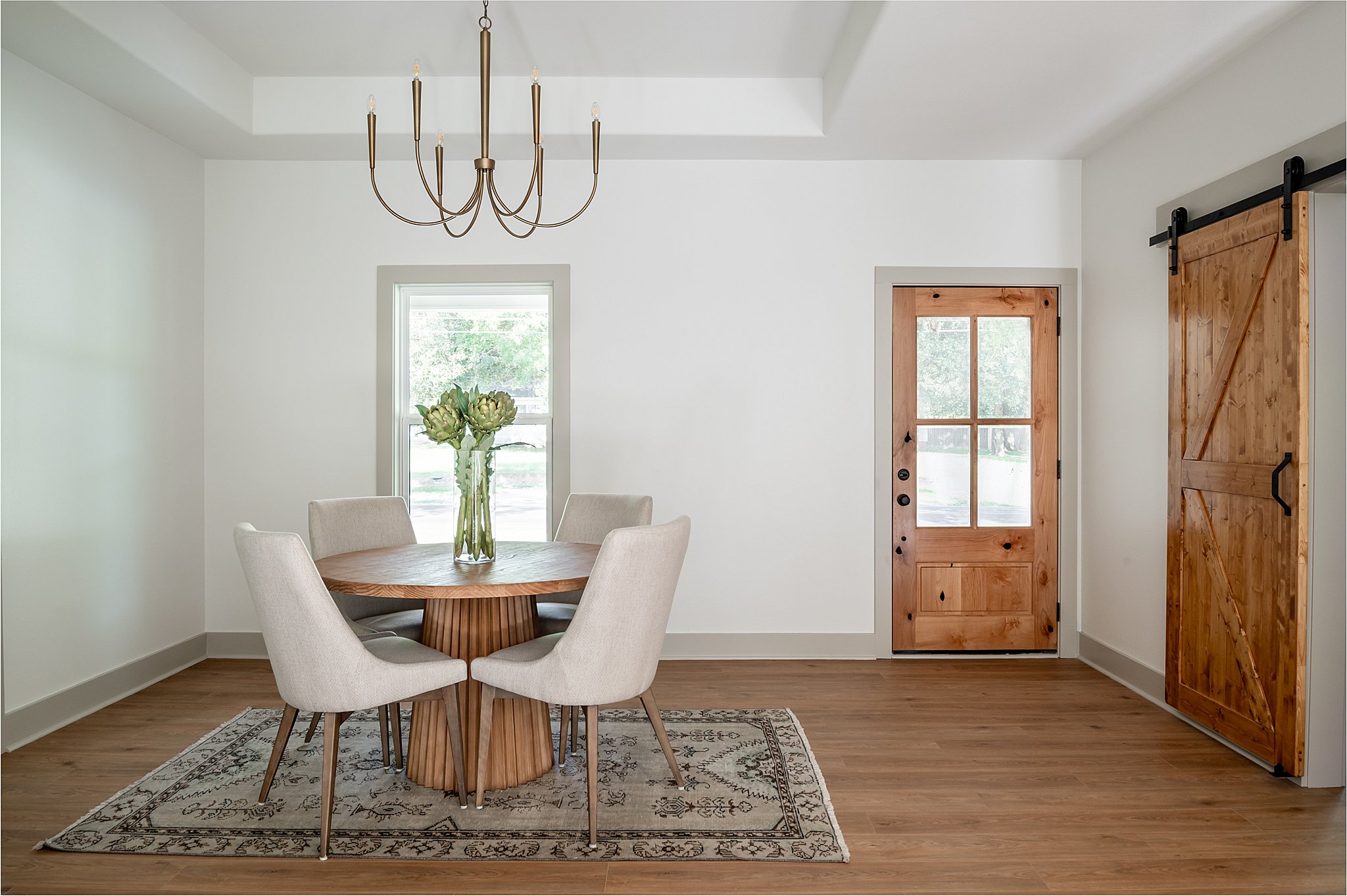 A dining room table on a rug