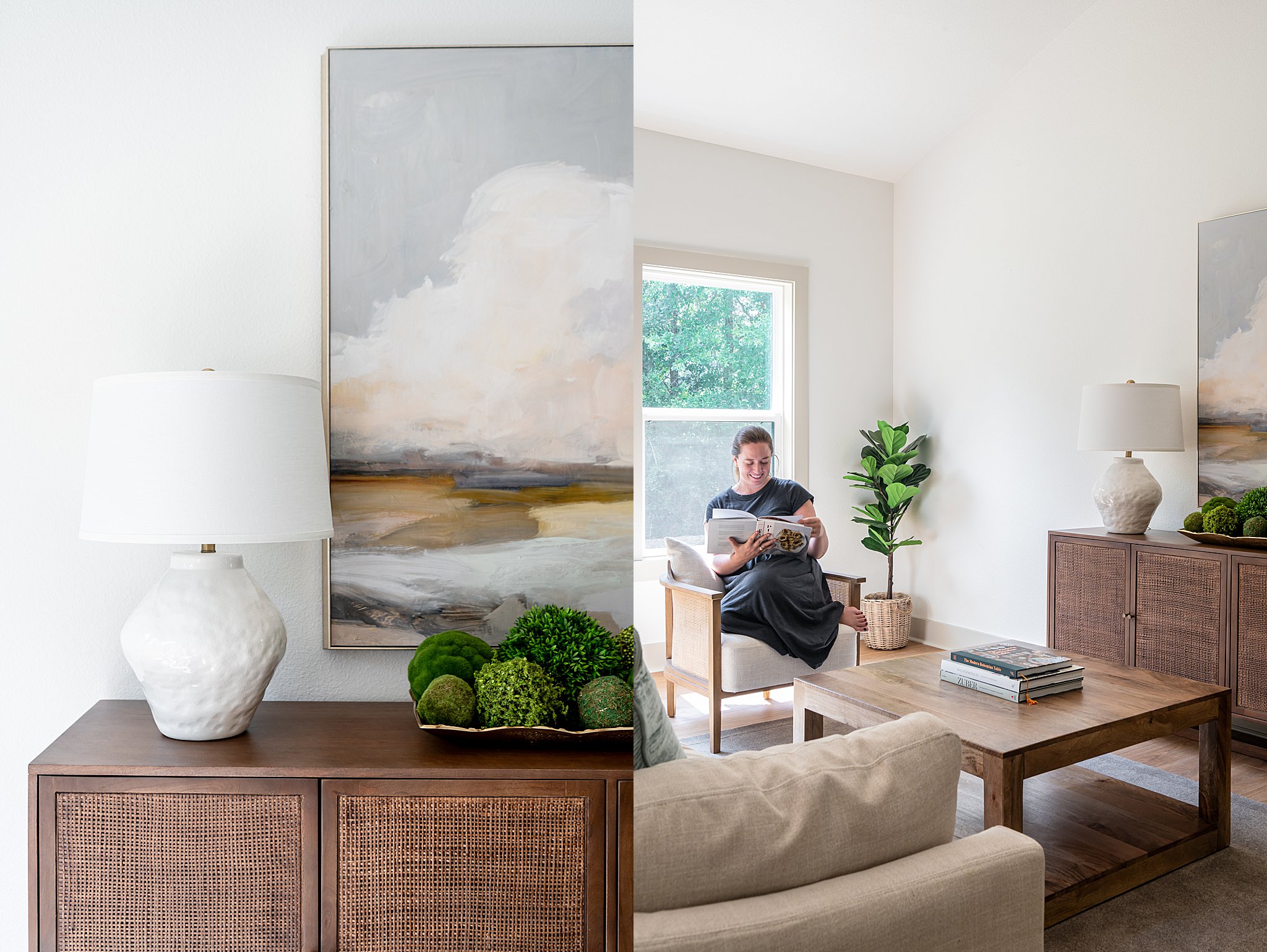 A vintage cabinet with a lamp and a painting and a woman reading a book in a living room chair.