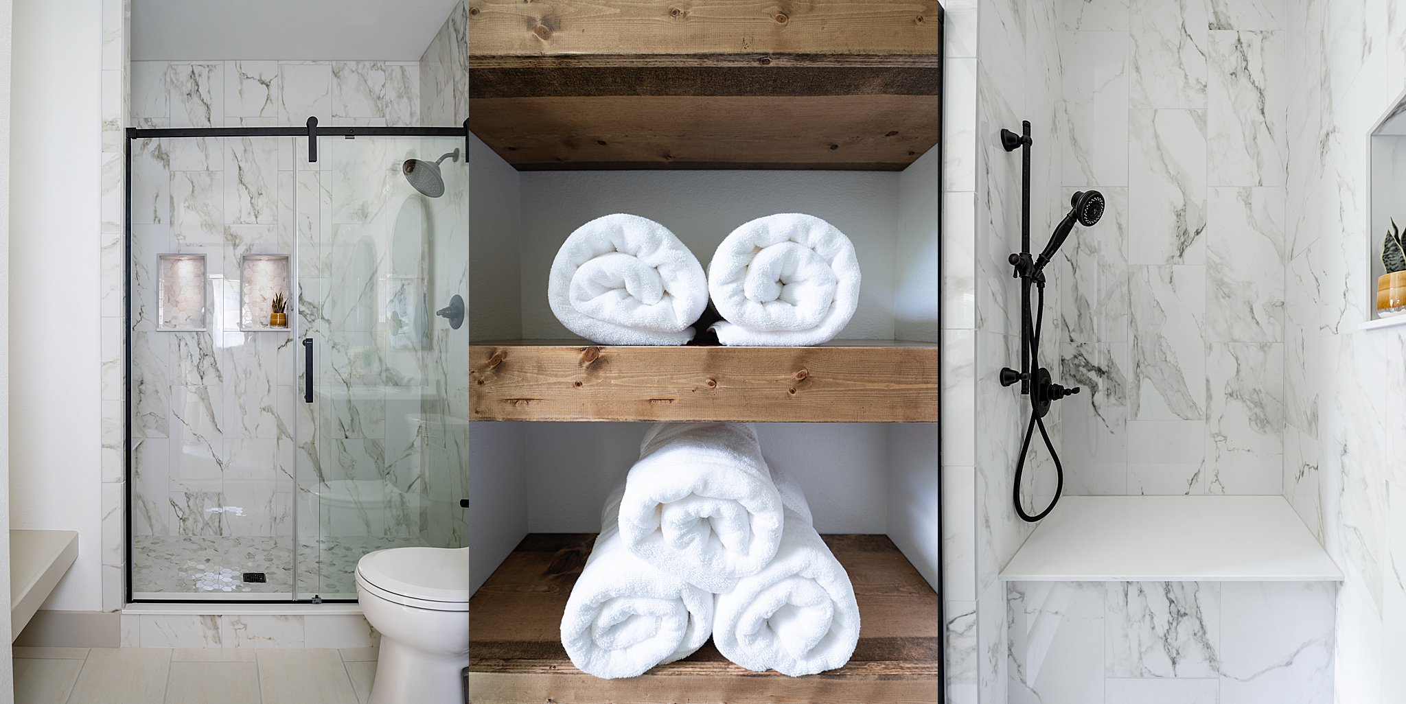 A glass shower and rolled-up towels on wooden shelves.