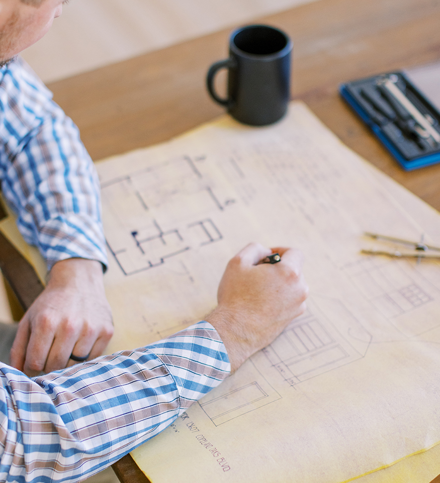 An architect designing blueprints for a house