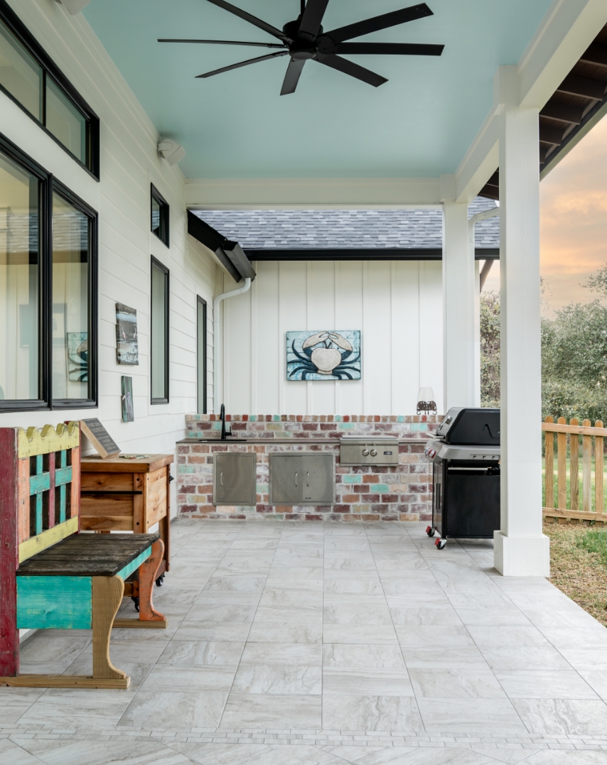 A kitchen with a refrigerator and sink in the kitchen island