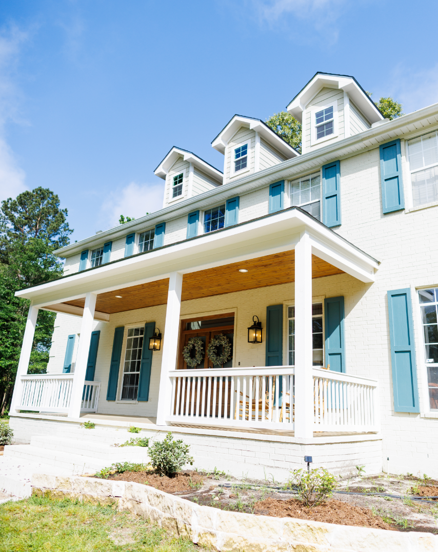 A modern kitchen with lights above a kitchen island.