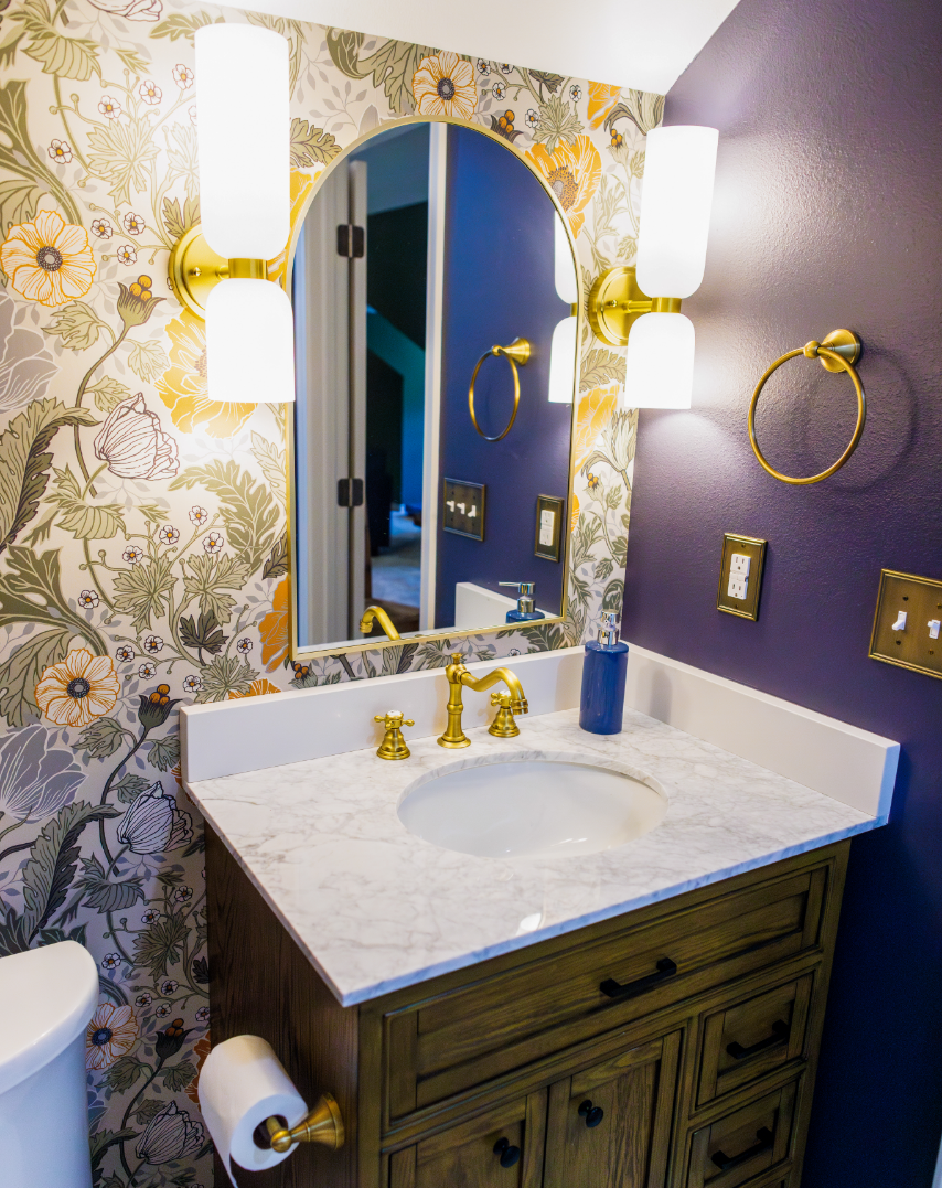 A kitchen with a refrigerator and sink in the kitchen island